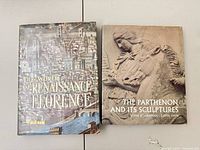 Both hardcover art history books side by side