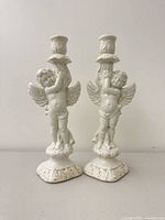 Front view of both Vietri ceramic angel candle holders