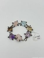 Bracelet arranged in circle showing crystal colors and clasp