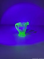 Pitcher glowing bright green under black light