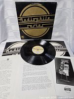 Front cover, vinyl record and insert visible