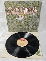 Record on sleeve front showing label and cover art