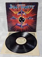 Front cover propped behind record and inner sleeve