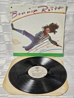Front sleeve and vinyl record displayed