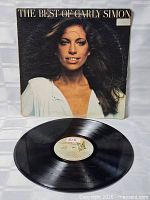 Front cover with title "The Best Of Carly Simon" and artist portrait
