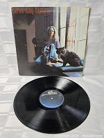 Front cover of Carole King Tapestry LP with record displayed
