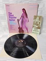 Front cover, inner sleeve and vinyl disc visible