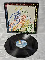 Front of jacket and vinyl record showing MCA rainbow label