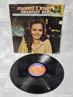 Front of record sleeve with artist portrait and title