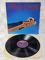 Front cover with vinyl record displayed