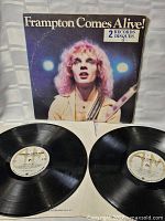 Front gatefold sleeve with artist image and title