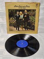 Front of sleeve and vinyl record showing blue label