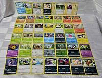 Overhead view showing 42 of the Pokémon cards laid out in rows