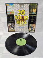 Front sleeve of 20 Solid Hits Volume II with LP displayed