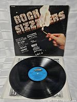Front sleeve with opened inner sleeve and vinyl showing blue Polystar label