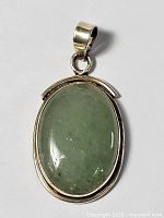 front view showing jade cabochon and sterling frame