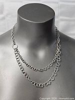 Necklace draped on bust showing double-strand circle link design