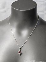 Full view of necklace on bust, showing chain length and pendant