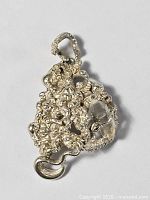 Front view showing twisted silver nugget work and quartz crystal
