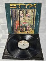 Outer sleeve opened with vinyl record displayed