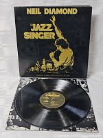 Front gatefold sleeve and vinyl record displayed