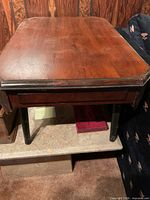 Side angle showing drawer, legs and finish wear