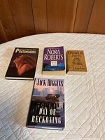 Front covers of four novels