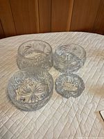 All four crystal bowls displayed on table