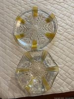 Round crystal platter and hexagonal bowl showing starburst cuts and gold panels