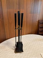 Full view of fireplace tool set on stand
