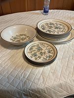 Set showing serving bowl, dinner plates and salad plates