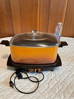 Complete West Bend slow cooker set with pot, lid, base and power cord visible