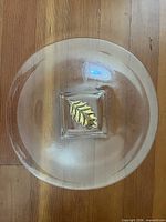 top view of clear glass platter showing gold leaf in square center