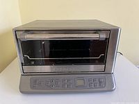 Front view of Cuisinart TOB-195C toaster oven, door closed showing control panel and handle