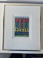 Front view of framed etching showing entire artwork, mat and frame