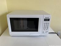Front view of Panasonic white countertop microwave model NN-S335WF