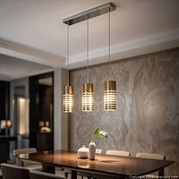 Pendant hanging above table showcasing three cylindrical shades and rectangular canopy