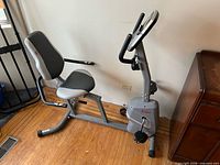 Full view of Sunny Health recumbent bike showing frame, seat, console and pedals