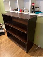 front and side view of dark wood 3-shelf bookcase