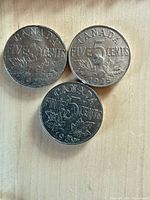 Reverse sides showing dates 1924, 1928, 1936 and denomination