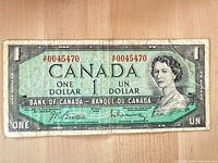 Obverse showing Queen Elizabeth II portrait, denomination, signatures, serial A0045470