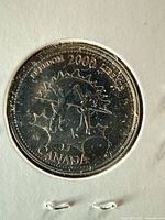 Reverse of 2000 Freedom 25¢ coin showing design and error details