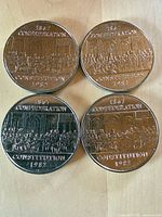 Four coins reverse side showing Constitution 1982 design