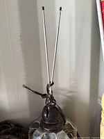 Front view of rabbit-ear antenna with telescopic rods and attached cable