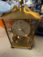Front view of brass glass anniversary clock
