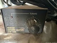 Front view of Numark CB-190 antenna coupler showing label, tuning knob, power indicator