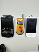 Three phones side by side on tabletop