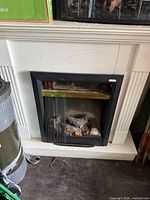 Full view of electric fireplace insert in mantel