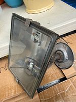 Front view of floodlight showing glass lens and housing