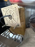 Horn speaker mounted on beige cash box